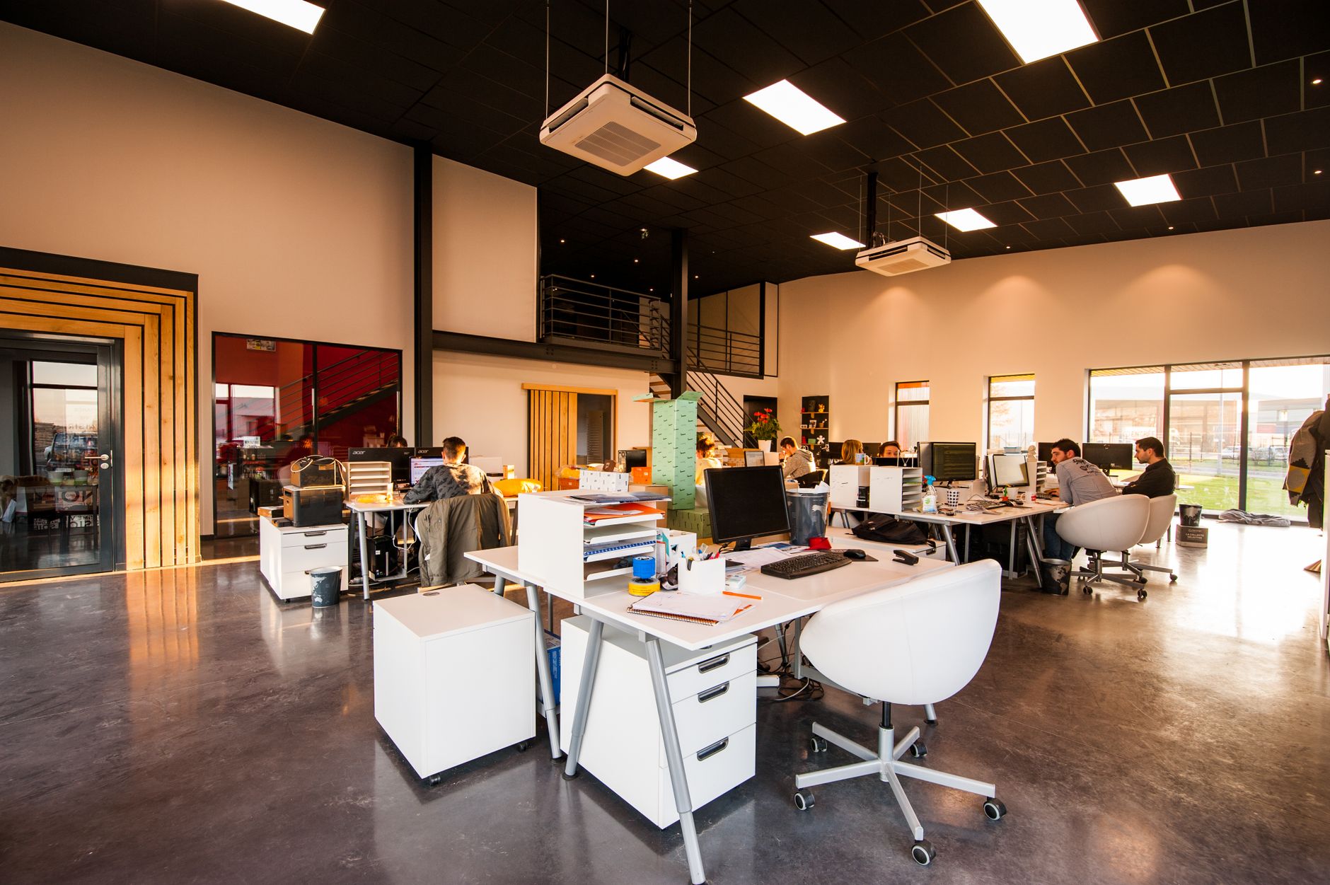 Open-plan office with tables and chairs